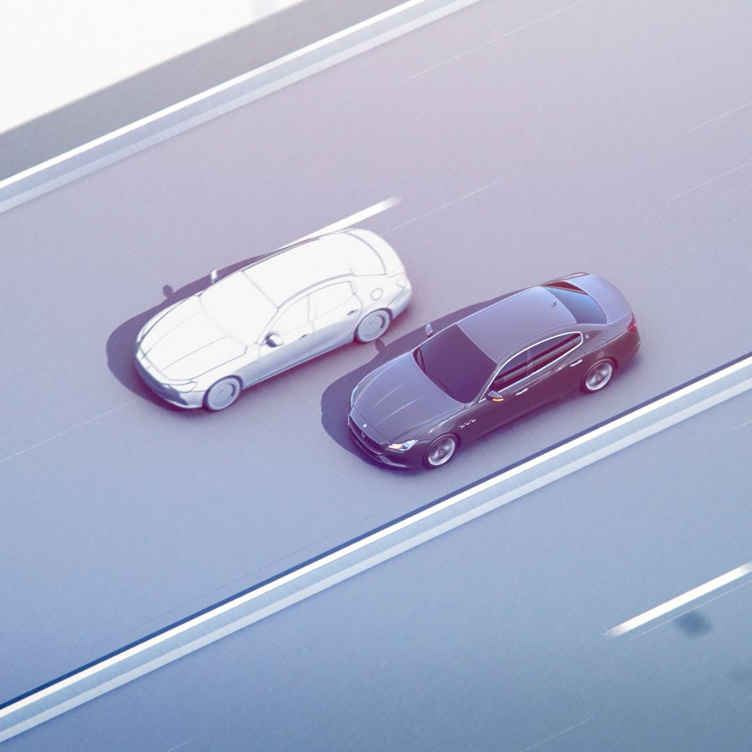 Traffic Sign Recognition - Maserati driving parallel to another car in a freeway
