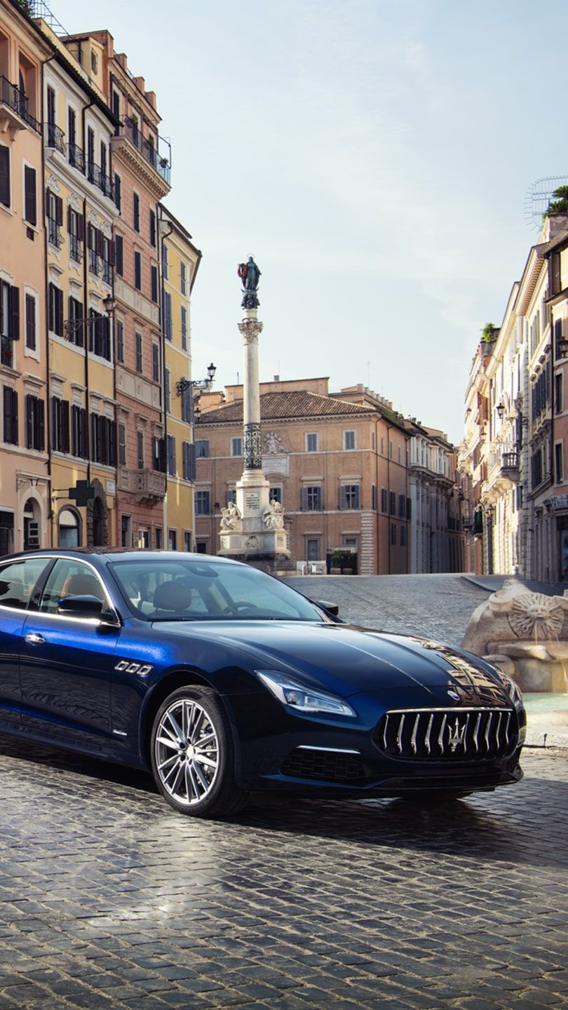Maserati Quattroporte - Piazza di Spagna (Spanish Square) in Rome on the background
