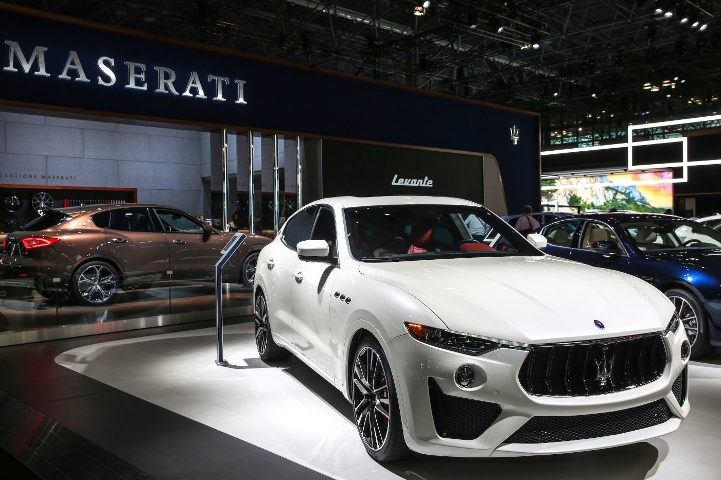 White Maserati model in showroom